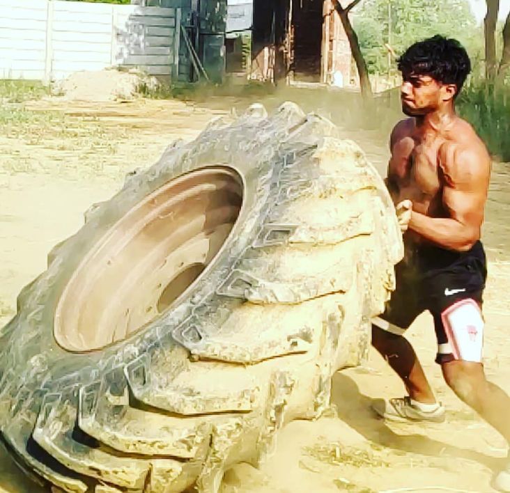 Ankit rolling a tire