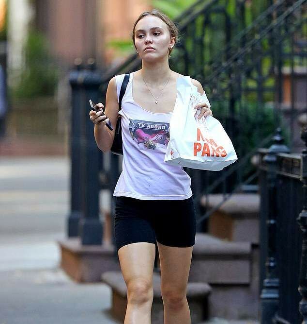 Lily-Rose Depp holding a takeaway meal