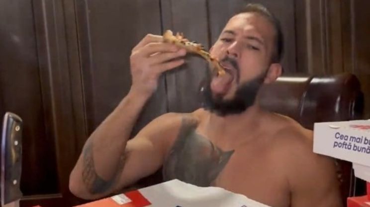 Andrew Tate eating pizza